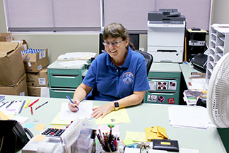 Clarksdale City Clerk, Cathy Clark at her desk.