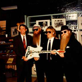 ZZ Top donates the custom "Muddywood" guitar to Sid Graves at the Carnegie Public Library.