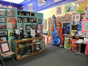 Rock & Blues Museum Clarksdale Mississippi's musical roots are on display at the Rock & Blues Museum in Clarksdale, where the diverse collection spans from a 1905 Edison phonograph to a 1980s newspaper from the UK announcing the assassination of John Lennon.